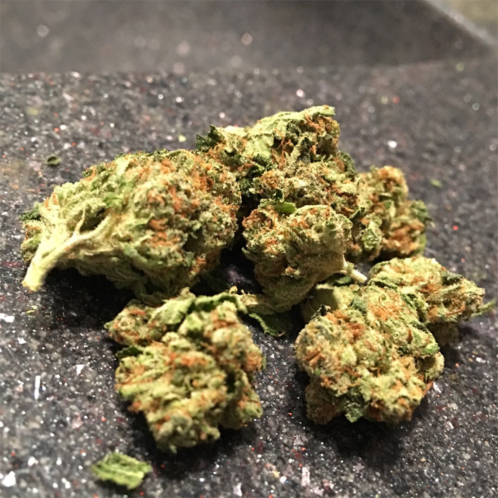 Angel OG marijuana strain flower with pungent and berry flavor and sleepy / creative effects - Rare Harvest indica
