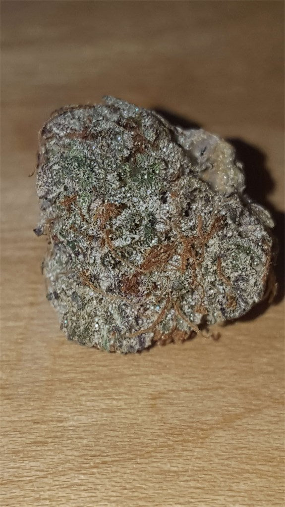 Black '84 marijuana strain flower with grape and pungent flavor and sleepy / relaxed effects - Rare Harvest indica
