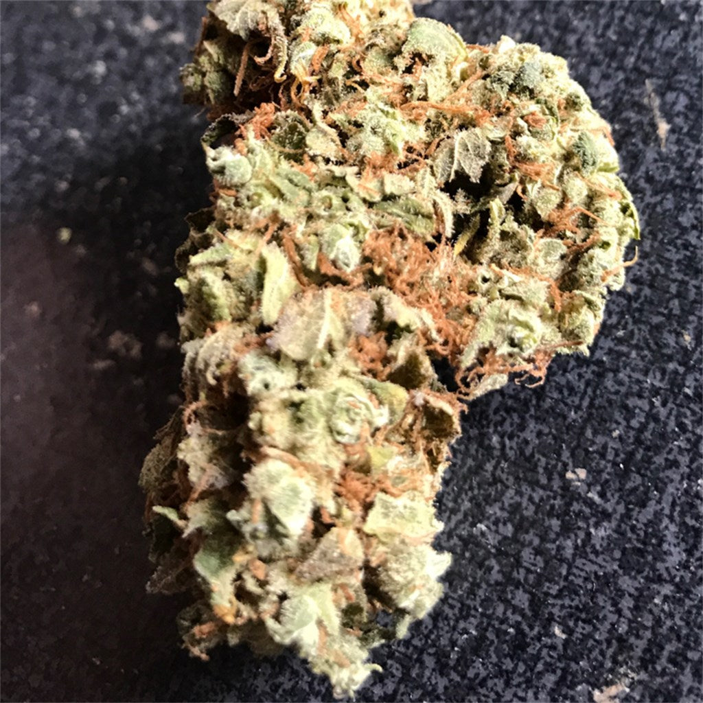 Blockhead marijuana strain flower with earthy and pungent flavor and sleepy / relaxed effects - Rare Harvest hybrid