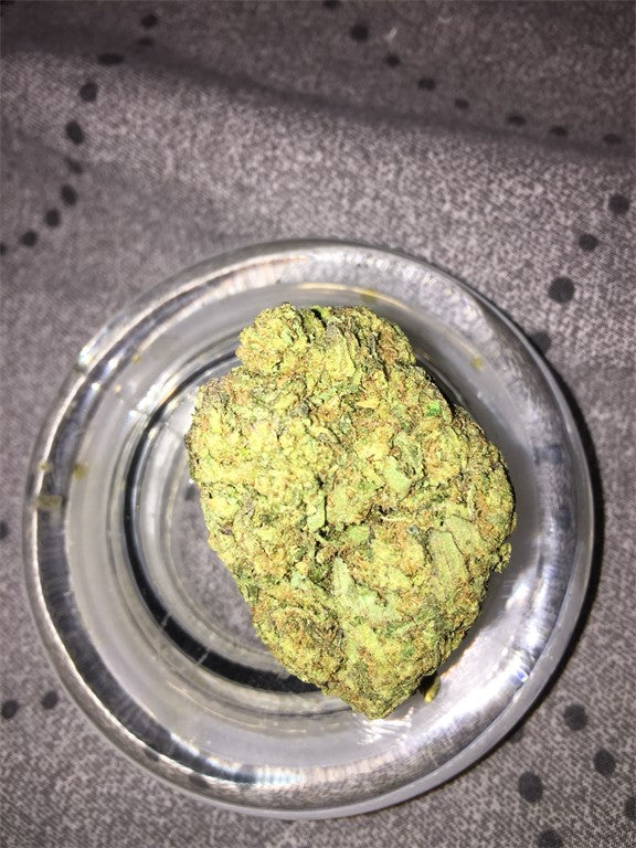Brains Damage marijuana strain flower with diesel and earthy flavor and sleepy / hungry effects - Rare Harvest indica