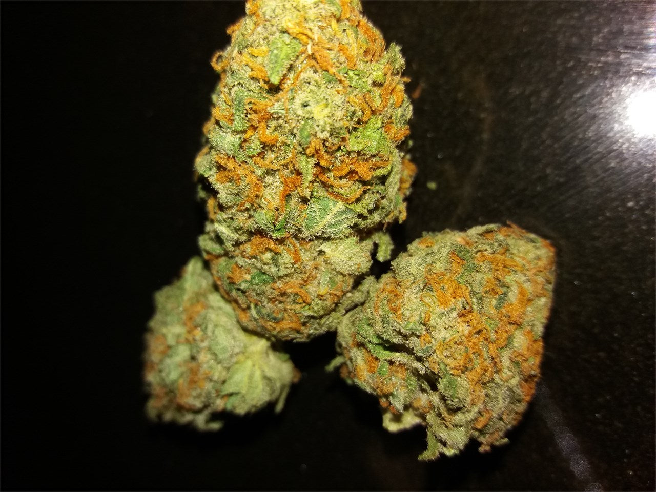 Cherries Jubilee marijuana strain flower with tree fruit and berry flavor and euphoric / uplifted effects - Rare Harvest indica
