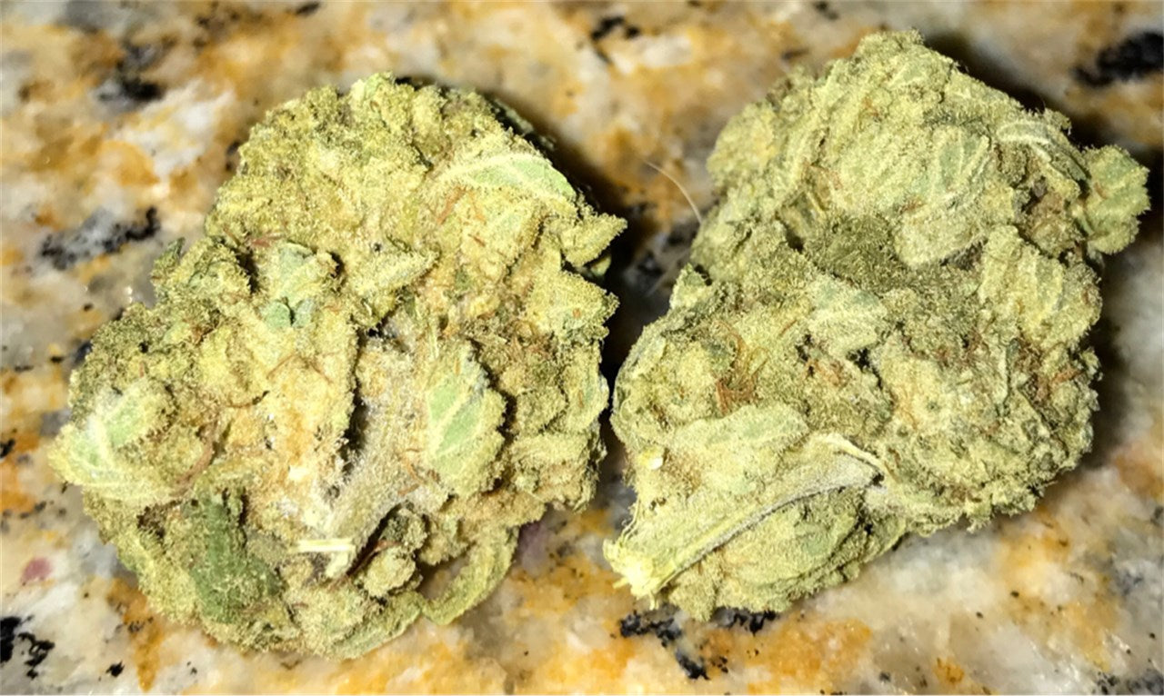 Cherry Slyder marijuana strain flower with strawberry and berry flavor and energetic / uplifted effects - Rare Harvest hybrid