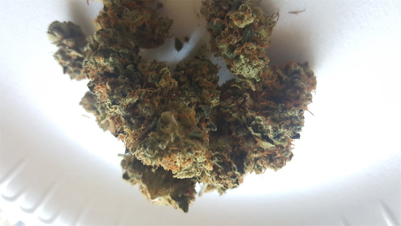 Chronic Thunder marijuana strain flower with pungent and diesel flavor and sleepy / relaxed effects - Rare Harvest indica