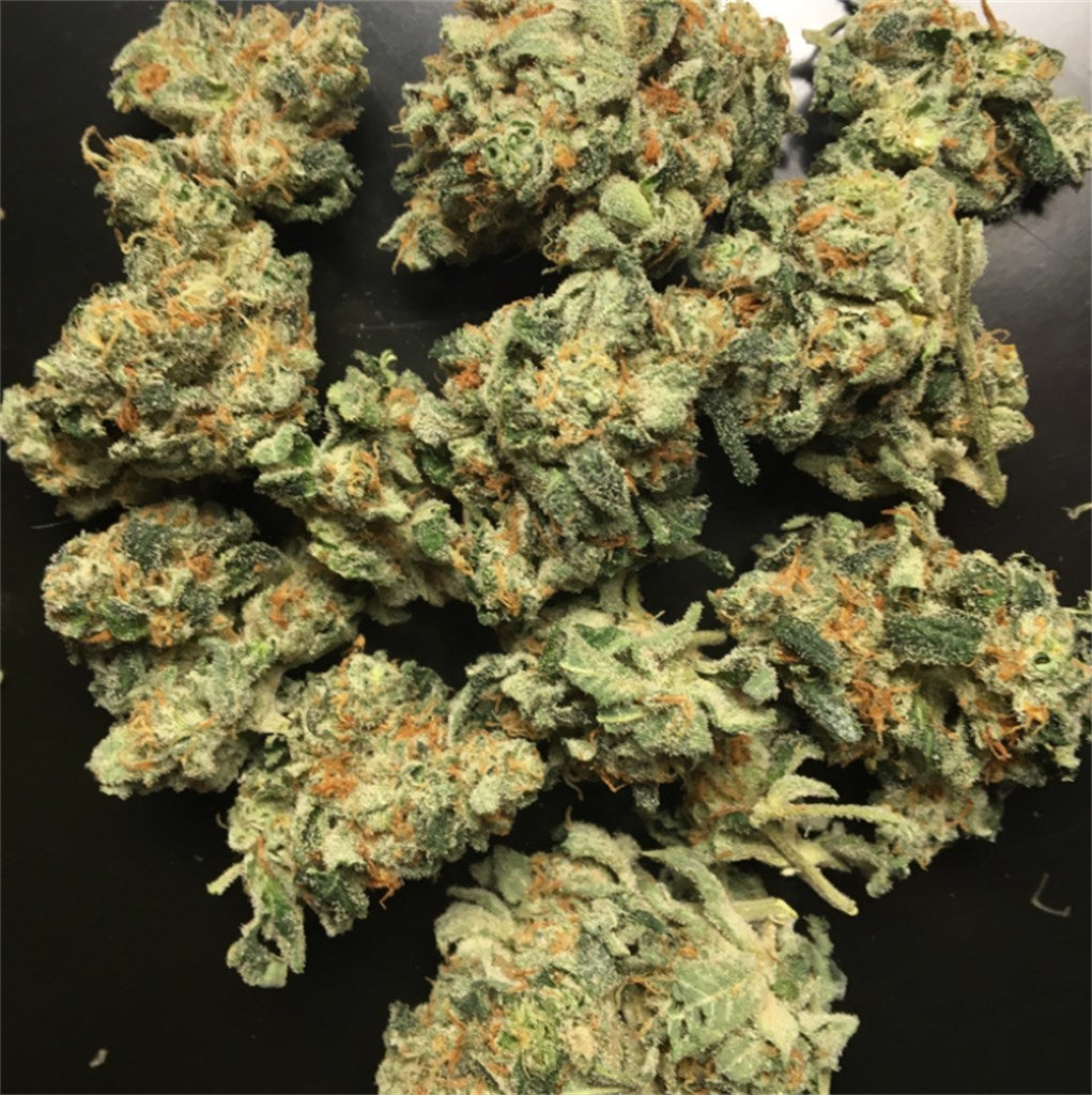 Lohan marijuana strain flower with lemon and orange flavor and uplifted / euphoric effects - Rare Harvest hybrid