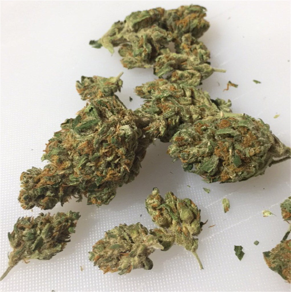 Dragon's Breath marijuana strain flower with spicy/herbal and skunk flavor and talkative / creative effects - Rare Harvest hybrid