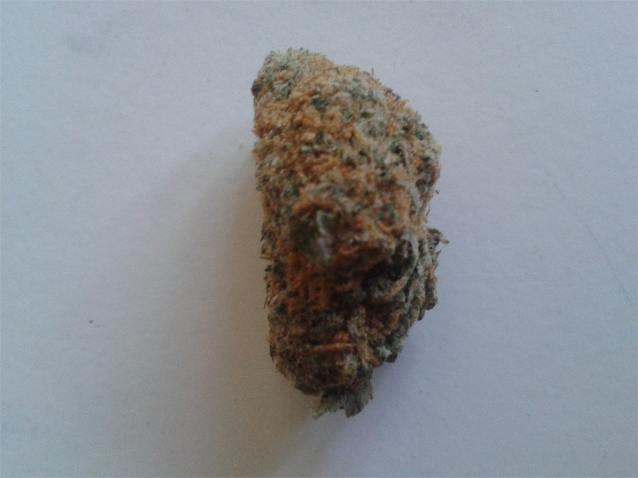 Dynamite marijuana strain flower with grapefruit and citrus flavor and sleepy / relaxed effects - Rare Harvest indica