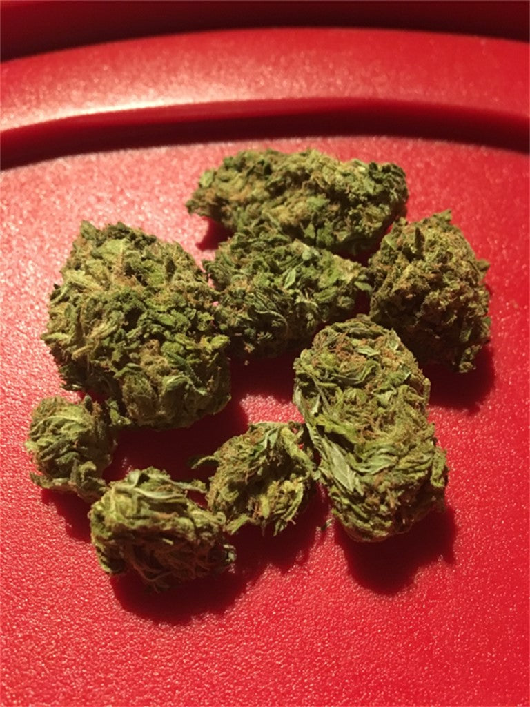 Gooberry marijuana strain flower with berry and woody flavor and relaxed / sleepy effects - Rare Harvest indica