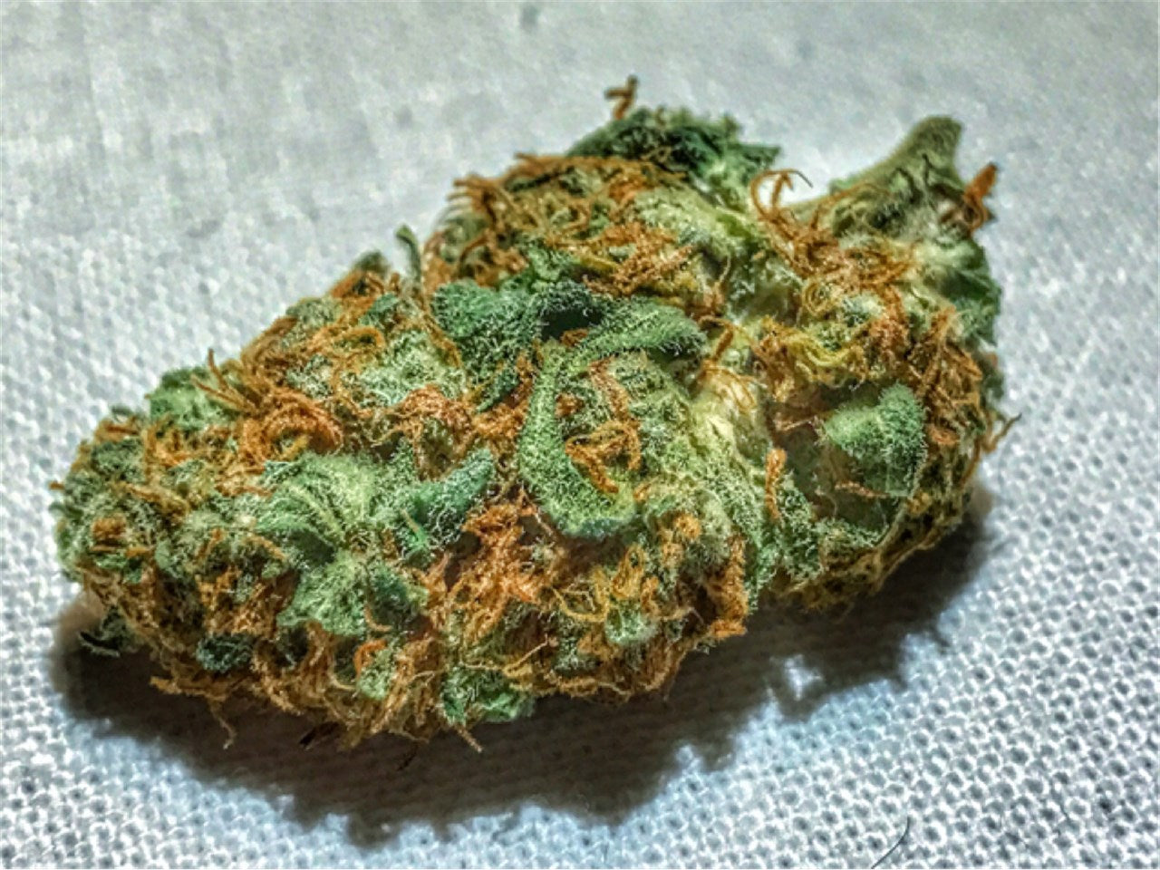 Good Medicine marijuana strain flower with earthy and spicy/herbal flavor and energetic / focused effects - Rare Harvest hybrid