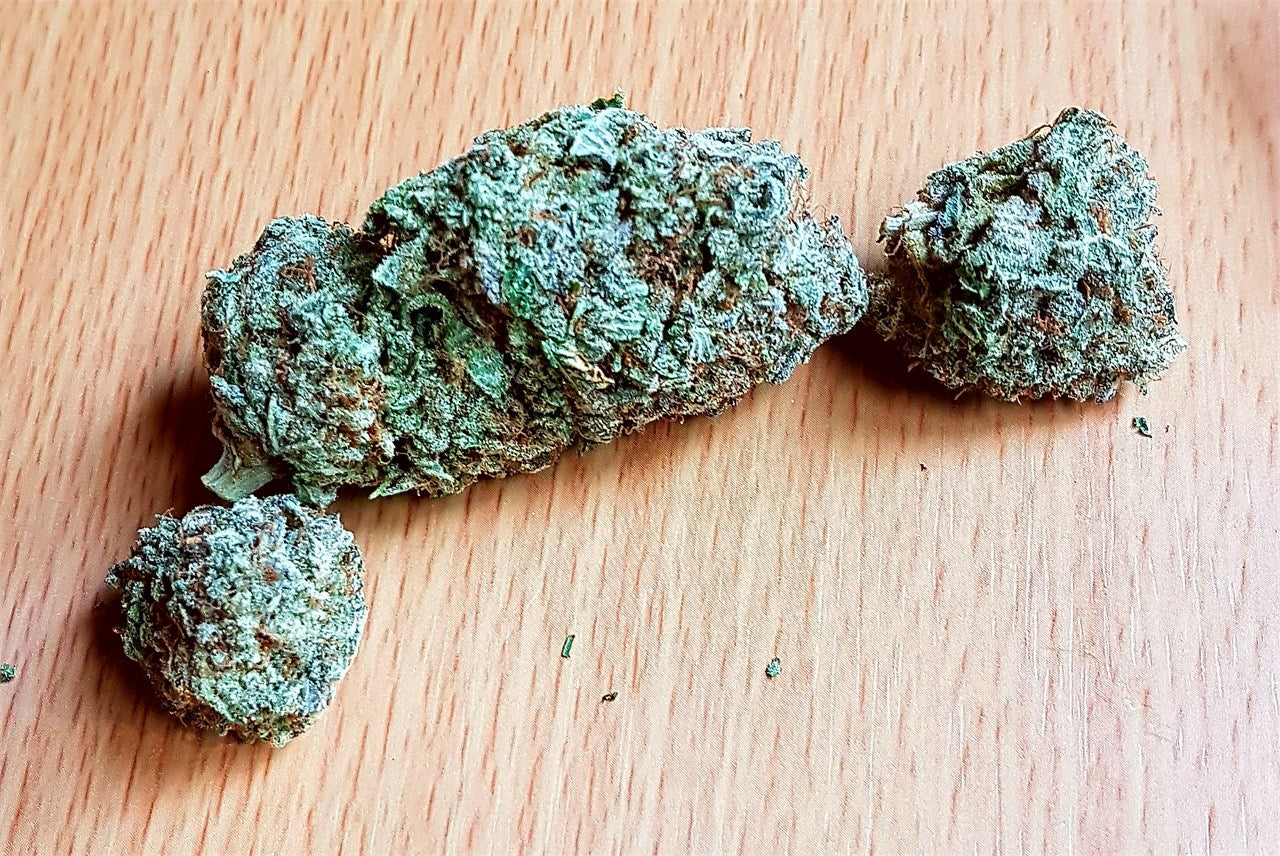Hulkamania marijuana strain flower with diesel and berry flavor and aroused / energetic effects - Rare Harvest indica