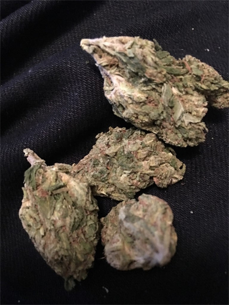 Jungle Juice marijuana strain flower with flowery and citrus flavor and relaxed / sleepy effects - Rare Harvest hybrid