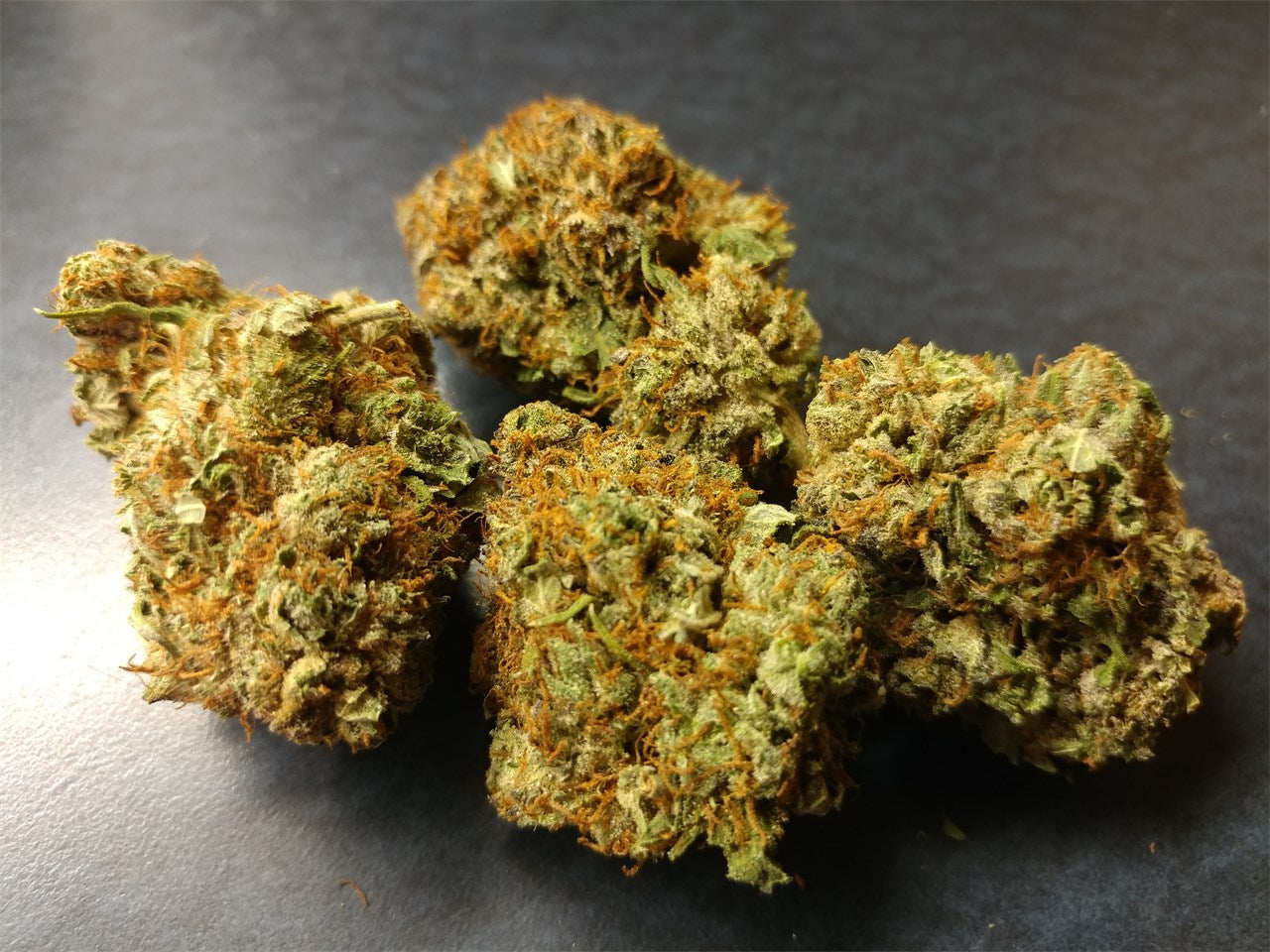 Mad Scientist marijuana strain flower with woody and pineapple flavor and sleepy / relaxed effects - Rare Harvest indica