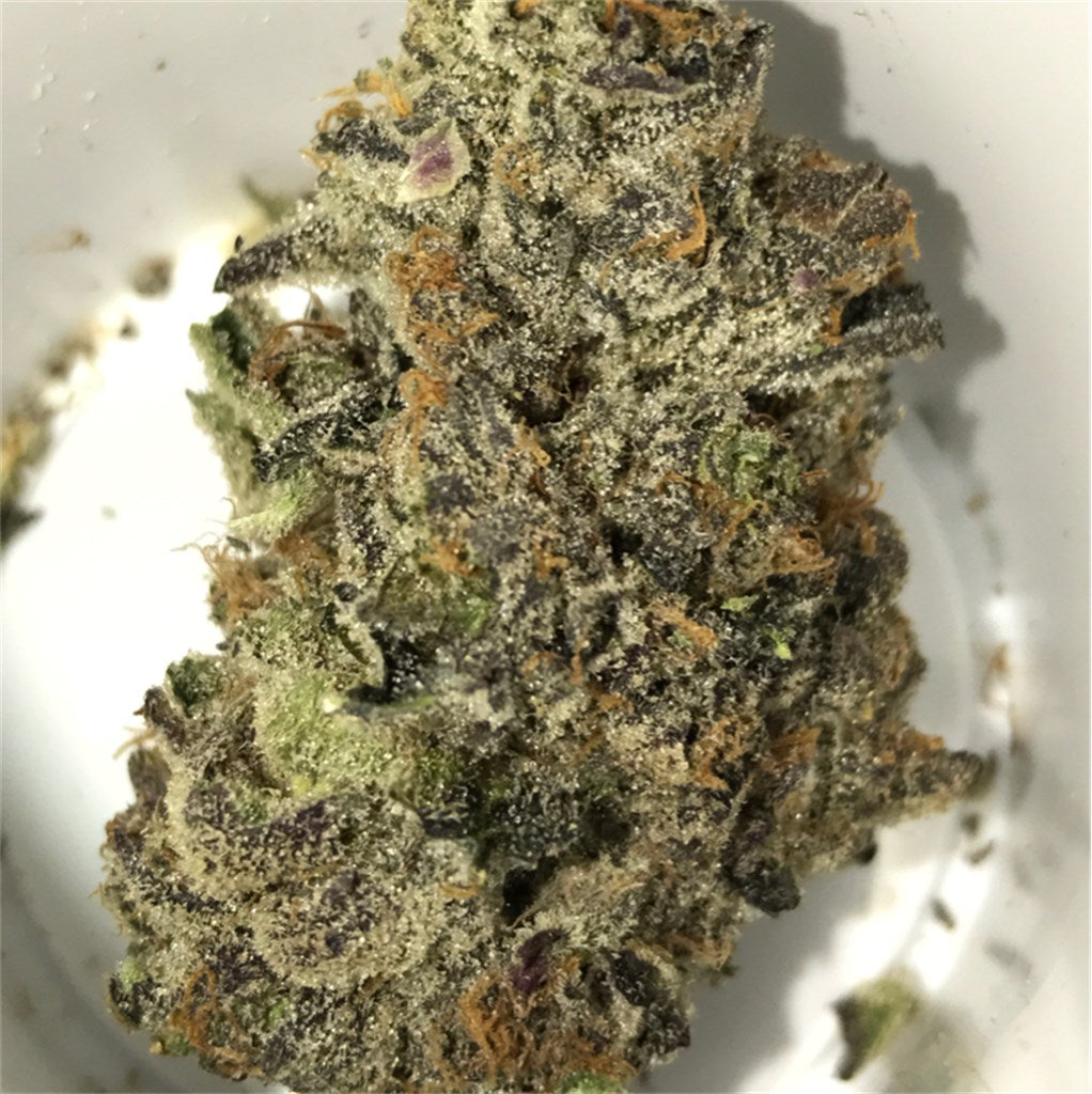 Magnificent Mile marijuana strain flower with diesel and berry flavor and uplifted / euphoric effects - Rare Harvest indica