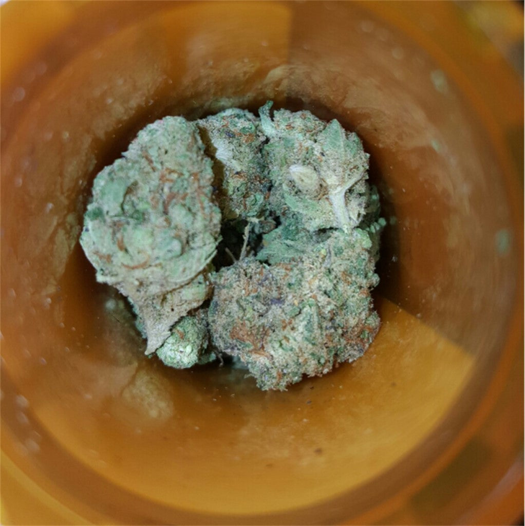OG Strawberry marijuana strain flower with strawberry and sweet flavor and relaxed / creative effects - Rare Harvest hybrid