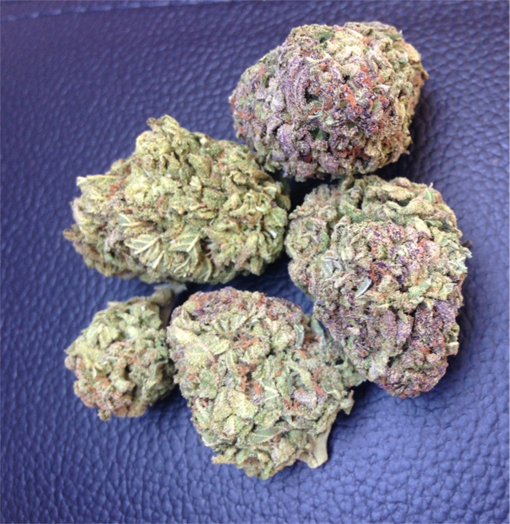 Purple Maui marijuana strain flower with grape and diesel flavor and energetic / happy effects - Rare Harvest hybrid