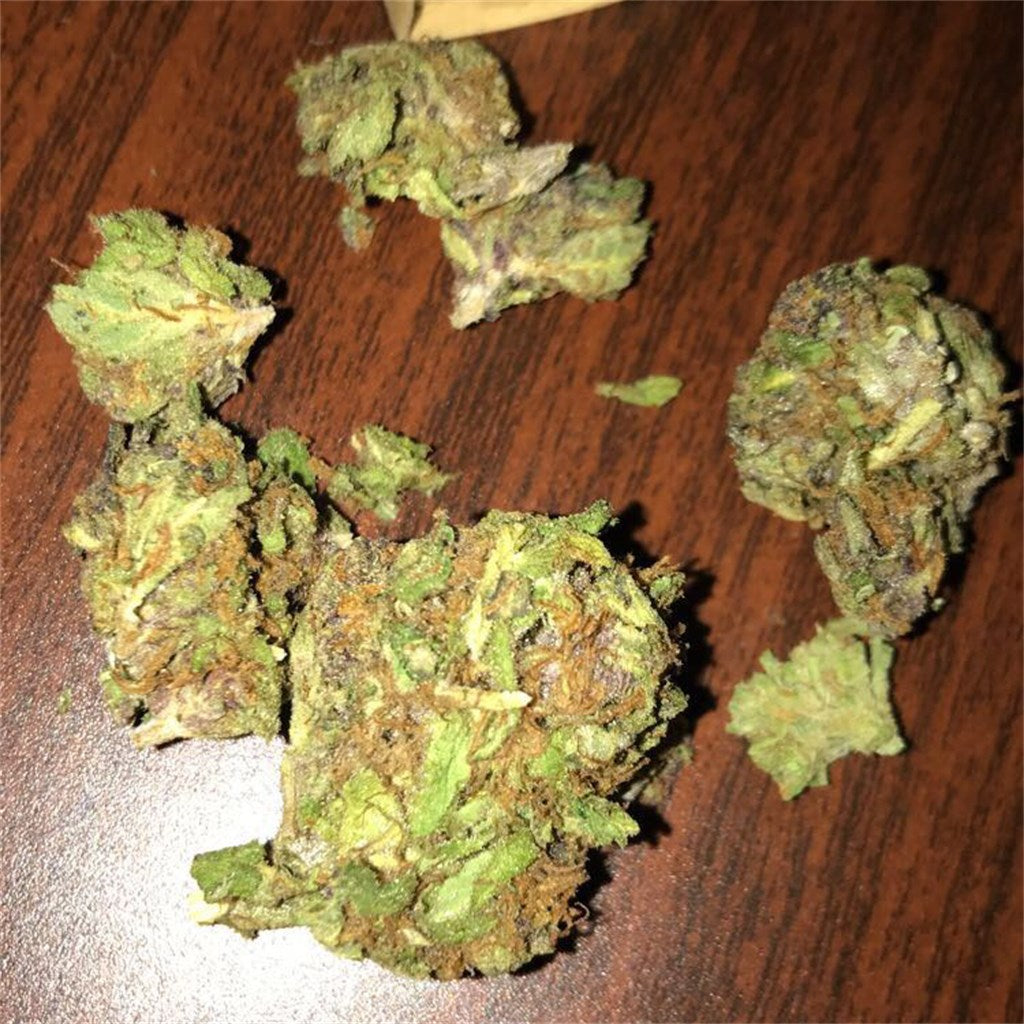 Rainbow marijuana strain flower with apricot and tropical flavor and aroused / tingly effects - Rare Harvest hybrid