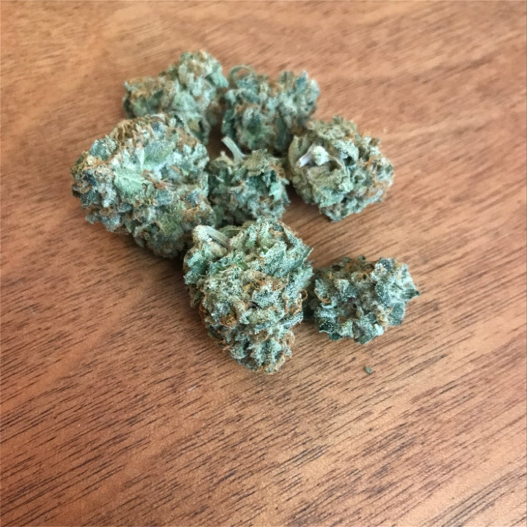 Sin Valley OG marijuana strain flower with earthy and lemon flavor and relaxed / hungry effects - Rare Harvest hybrid