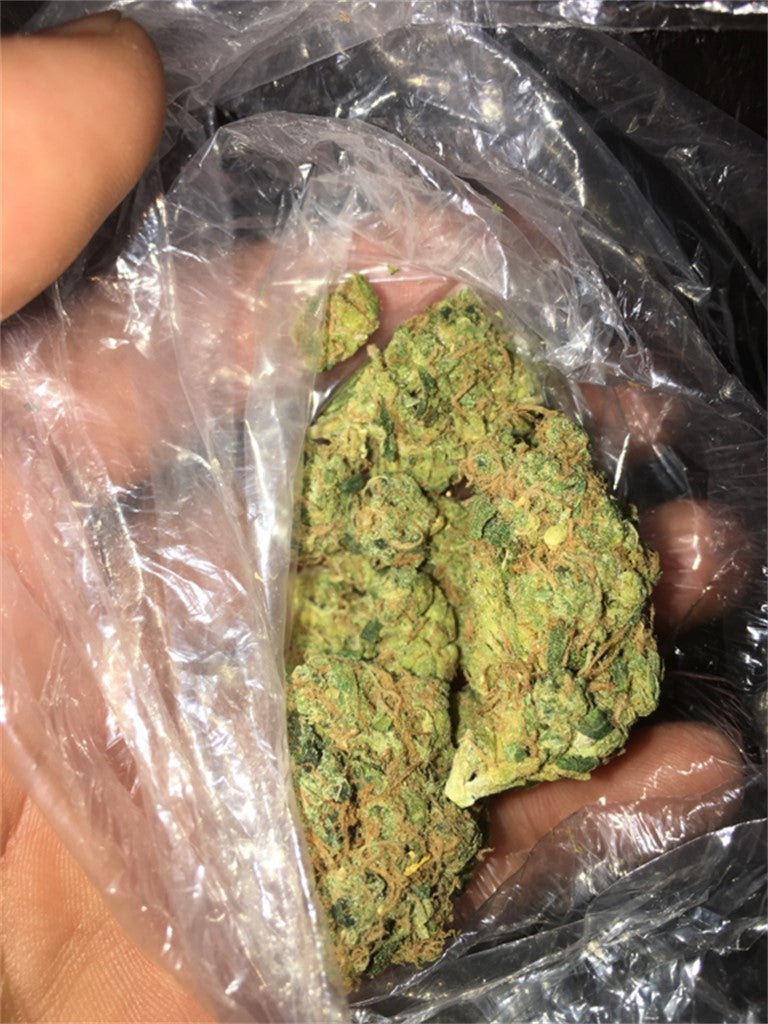 Sour Flower marijuana strain flower with skunk and earthy flavor and focused / energetic effects - Rare Harvest sativa