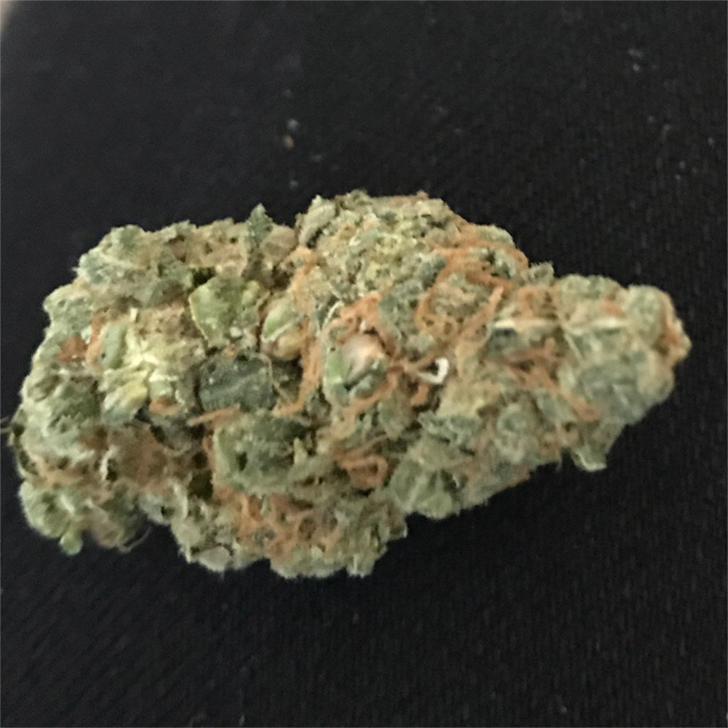 Strawberry Frost marijuana strain flower with strawberry and pineapple flavor and uplifted / euphoric effects - Rare Harvest indica