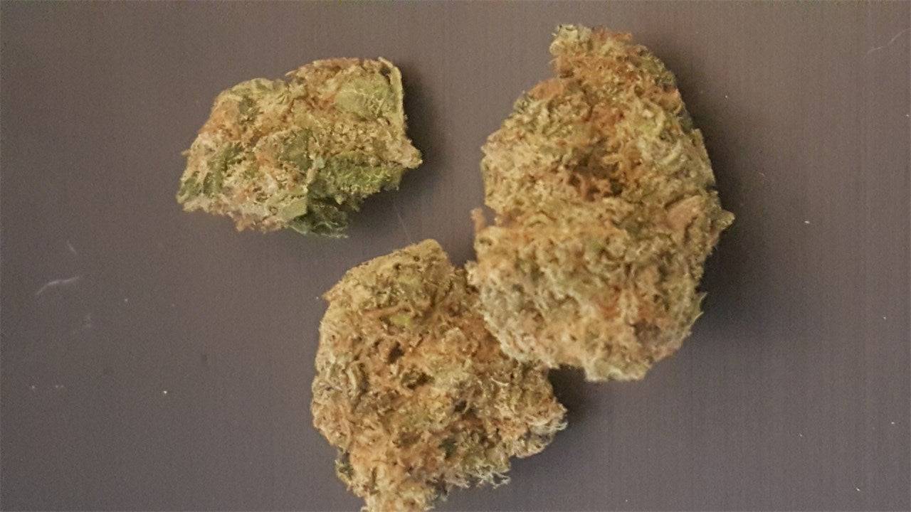 Sweet Baby Jane marijuana strain flower with citrus and berry flavor and sleepy / happy effects - Rare Harvest indica