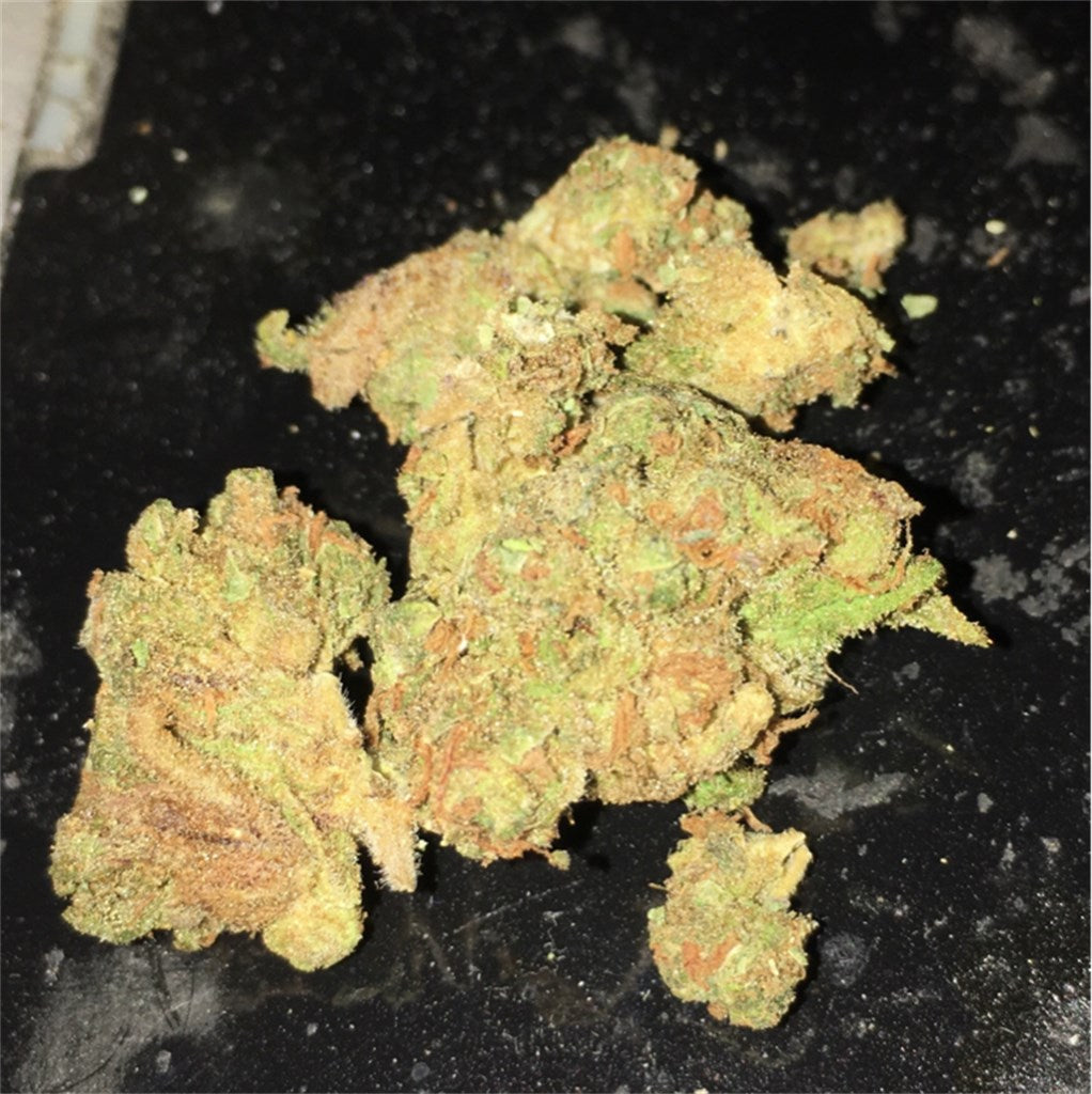 Sweet Deep Grapefruit marijuana strain flower with grapefruit and grape flavor and sleepy / hungry effects - Rare Harvest indica