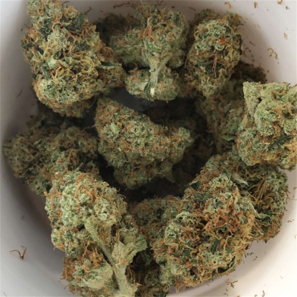 Tangerine Kush marijuana strain flower with orange and citrus flavor and relaxed / sleepy effects - Rare Harvest indica