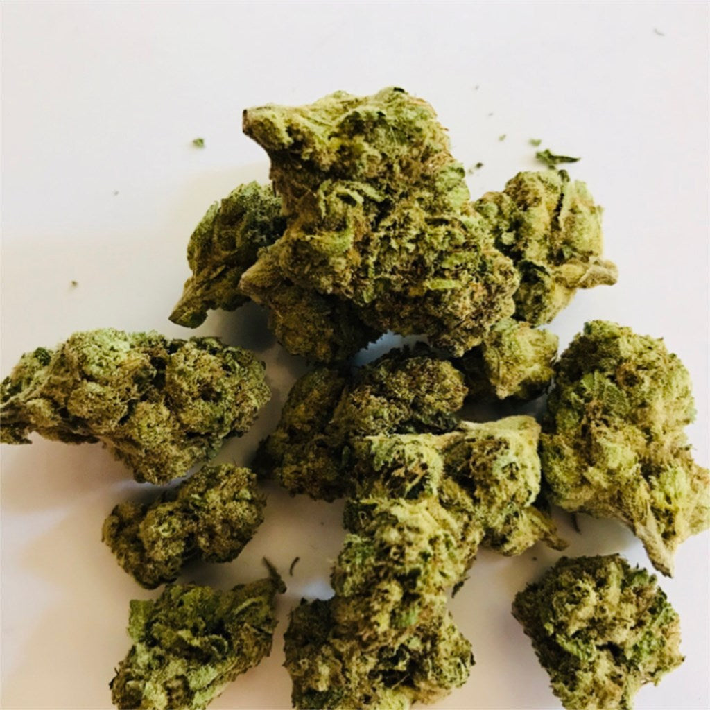 Trainwreck marijuana strain flower with pine and earthy flavor and euphoric / uplifted effects - Rare Harvest hybrid
