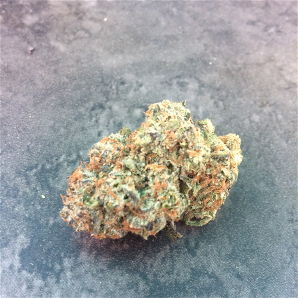 Triangle Kush marijuana strain flower with earthy and skunk flavor and relaxed / sleepy effects - Rare Harvest indica