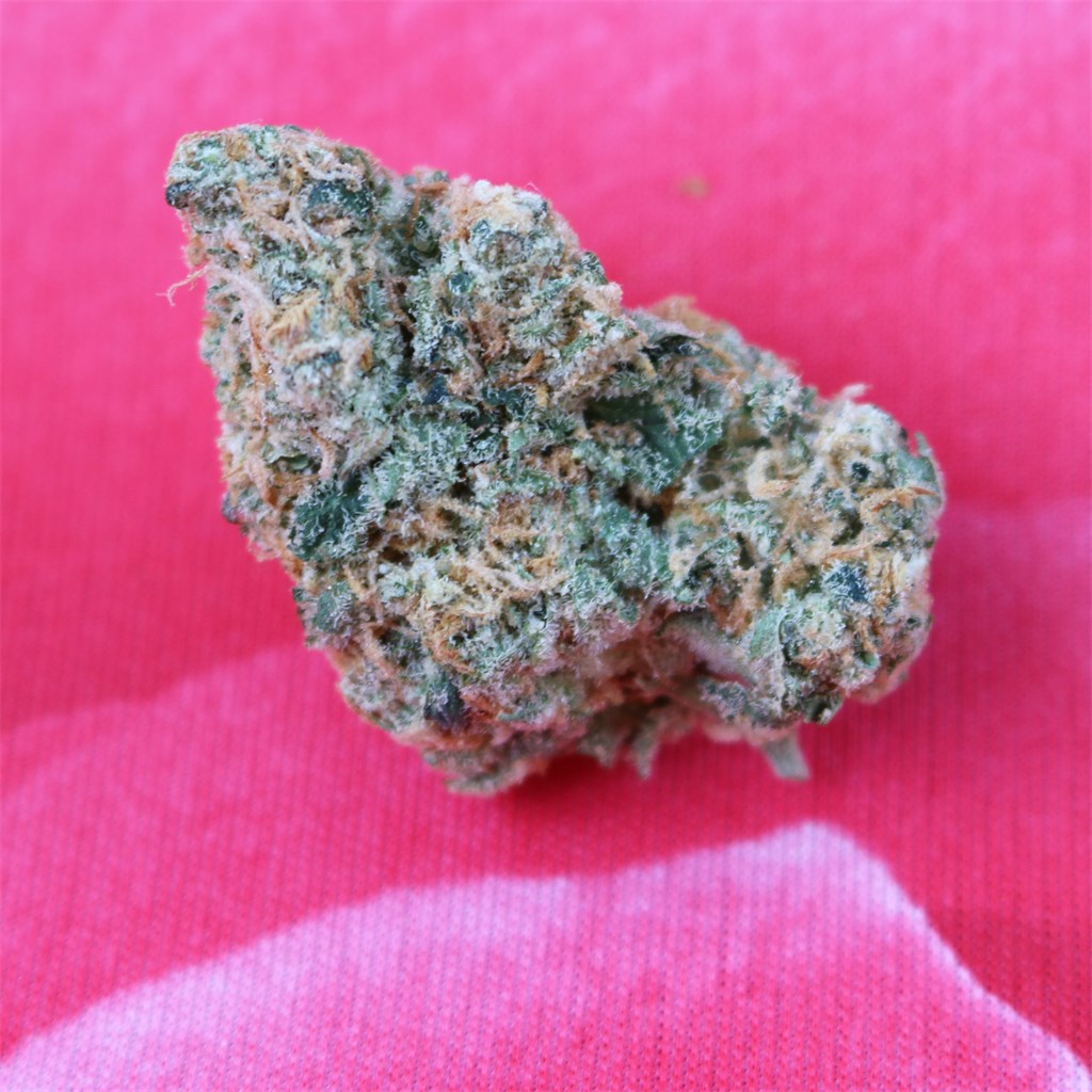 White Lotus marijuana strain flower with citrus and pineapple flavor and relaxed / euphoric effects - Rare Harvest hybrid