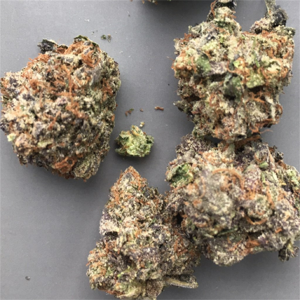 WMD marijuana strain flower with berry and diesel flavor and relaxed / happy effects - Rare Harvest indica
